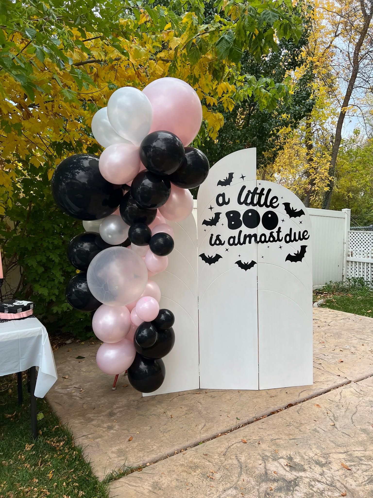 A little boo is almost due Halloween baby shower arched backdrop with black and pink balloons
